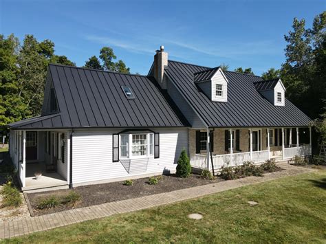 white houses with black metal roof|white house black roof pictures.